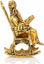 Golden Lord Ganesha Statue Sitting On A Rocking Chair And Reading Ramayan Showpiece